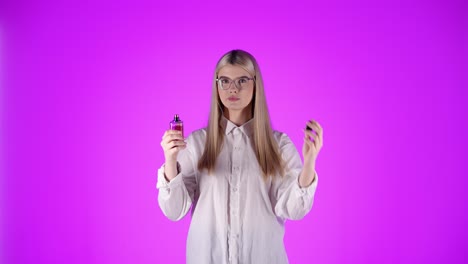 Young-woman-applies-perfume-on-neck-and-smells-it,-concept-get-on-a-date