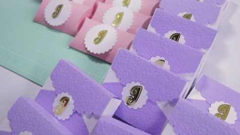diy party favor boxes: pink and purple with gold letter j