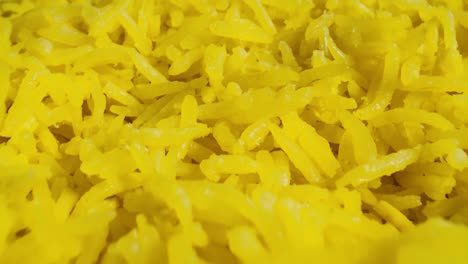 macro probe shot of cooked yellow basmati rice.