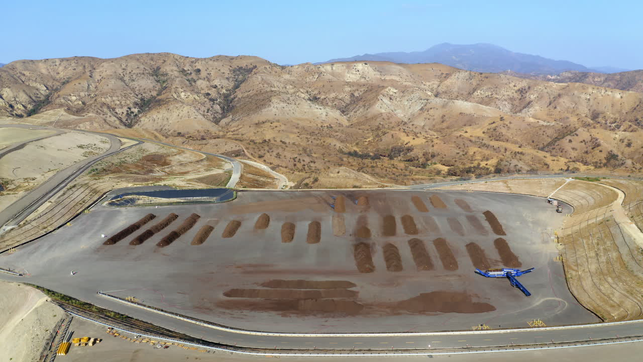 Aerial View of a Large-Scale Composting and Organic Material Processing Facility in Arid Mountains