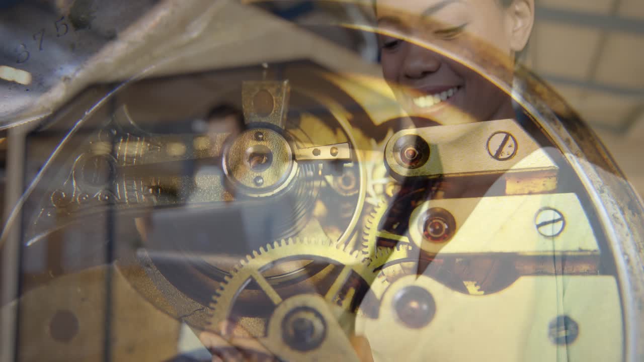 Composite video of watch mechanism against african american woman using digital tablet at office
