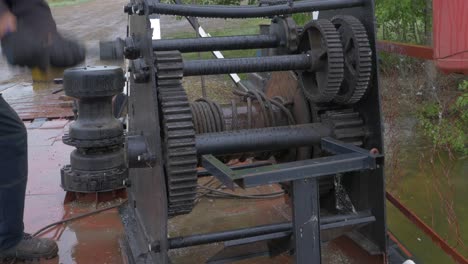 wet industrial winch with person