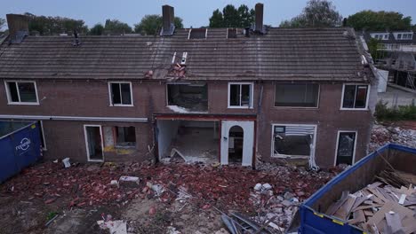 skips full of waste from buildings being demolished, aerial, reveal