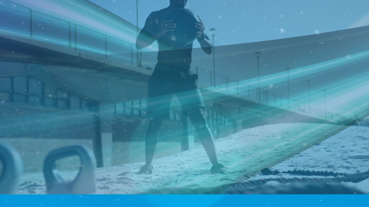 해변에서 의학 공과 함께 운동하는 아프리카계 미국인 피트 남자에 대한 디지털 파동