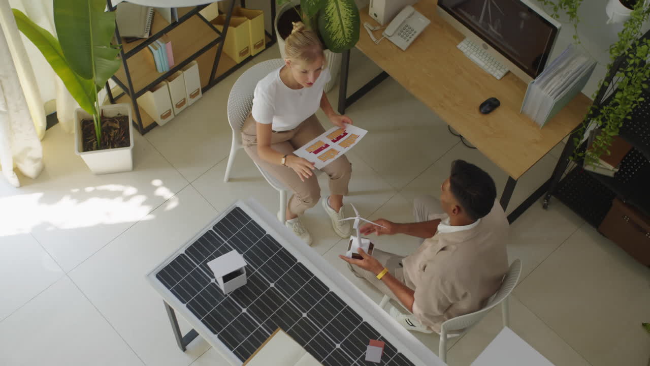 Sales Manager Having Talk with Client about Alternative Energy Project