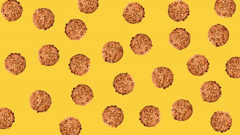 seamless looping pattern animation of peanut cookies that wiggle on a yellow background