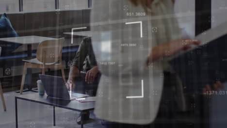 animation of financial data processing over diverse businessmen using laptop