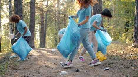 community volunteers cleaning up a forest path