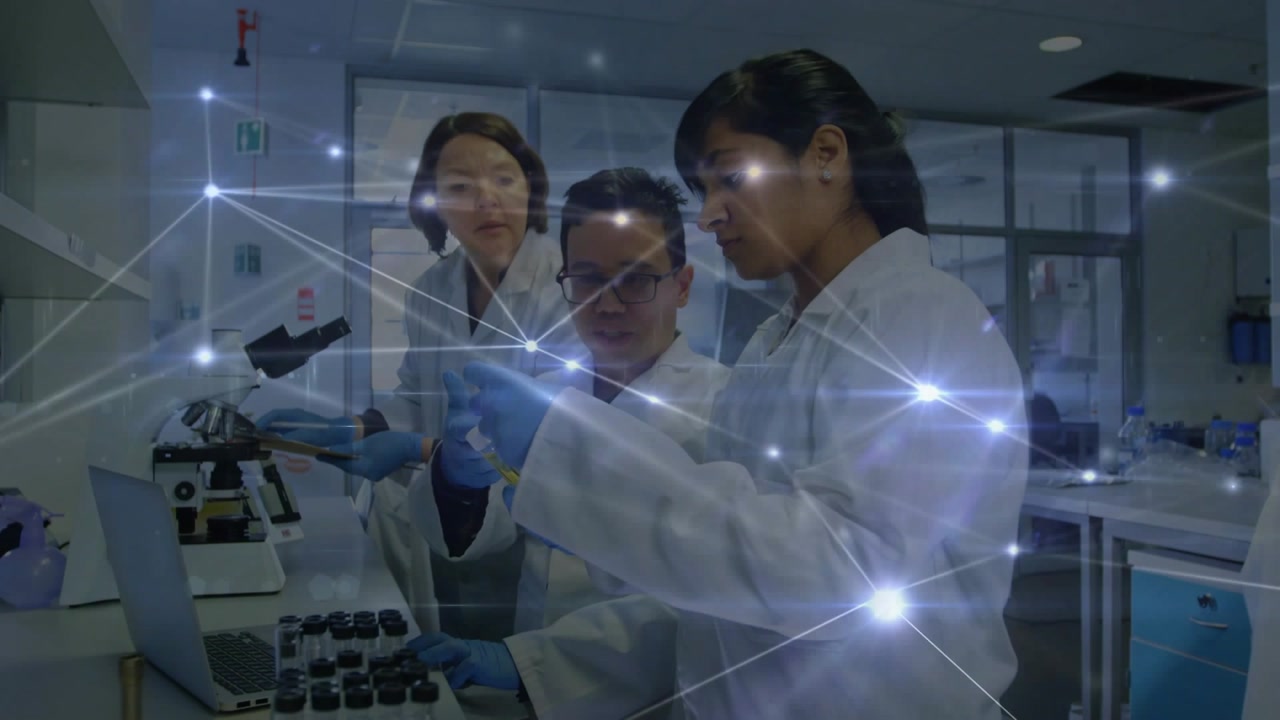 Three lab scientists handling vials, camera focus sparking network overlay during pipette transfer