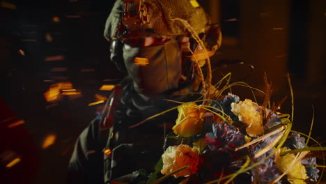 soldier with flowers in dark setting