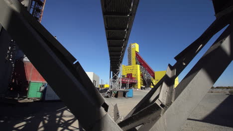 industrial facility with conveyor belt and metal structures