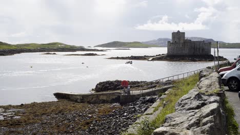 Static-shot-of-a-rhib-driving-towards-Kisimul-Castle-in-Castlebay