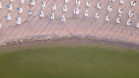 Drone-view-of-beautiful-beach-sea-waves-breaking-on-sandy-coastline