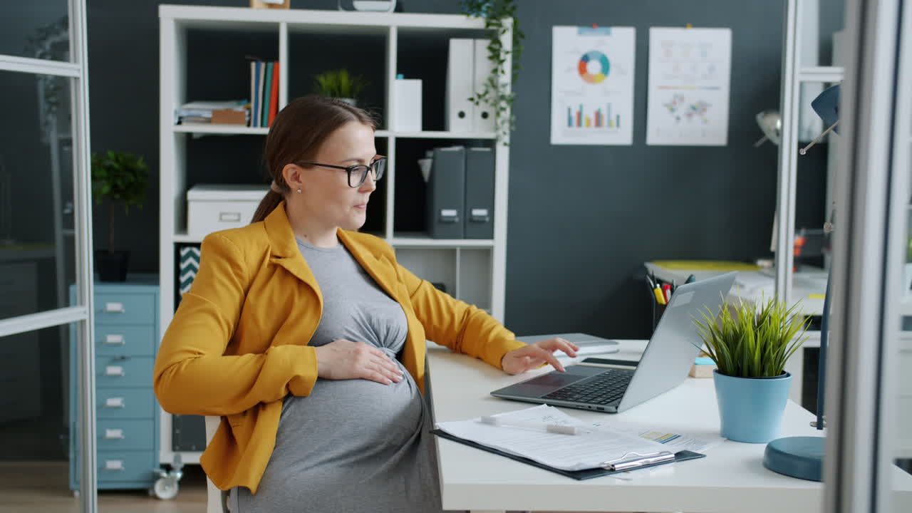 Pregnant Woman Working in Modern Office
