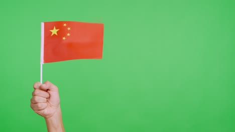 wind waving a chinese pennant holding by a person