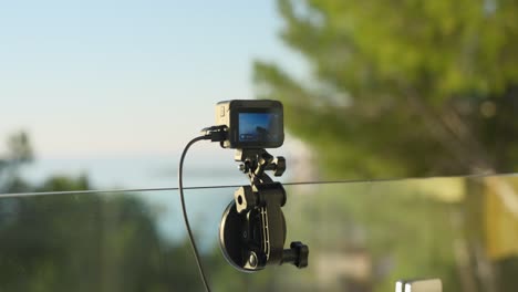 action camera mounted on glass railing outdoor