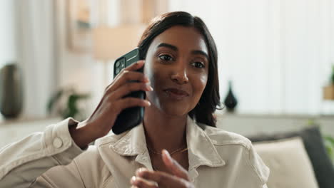 woman smiling while talking on the phone