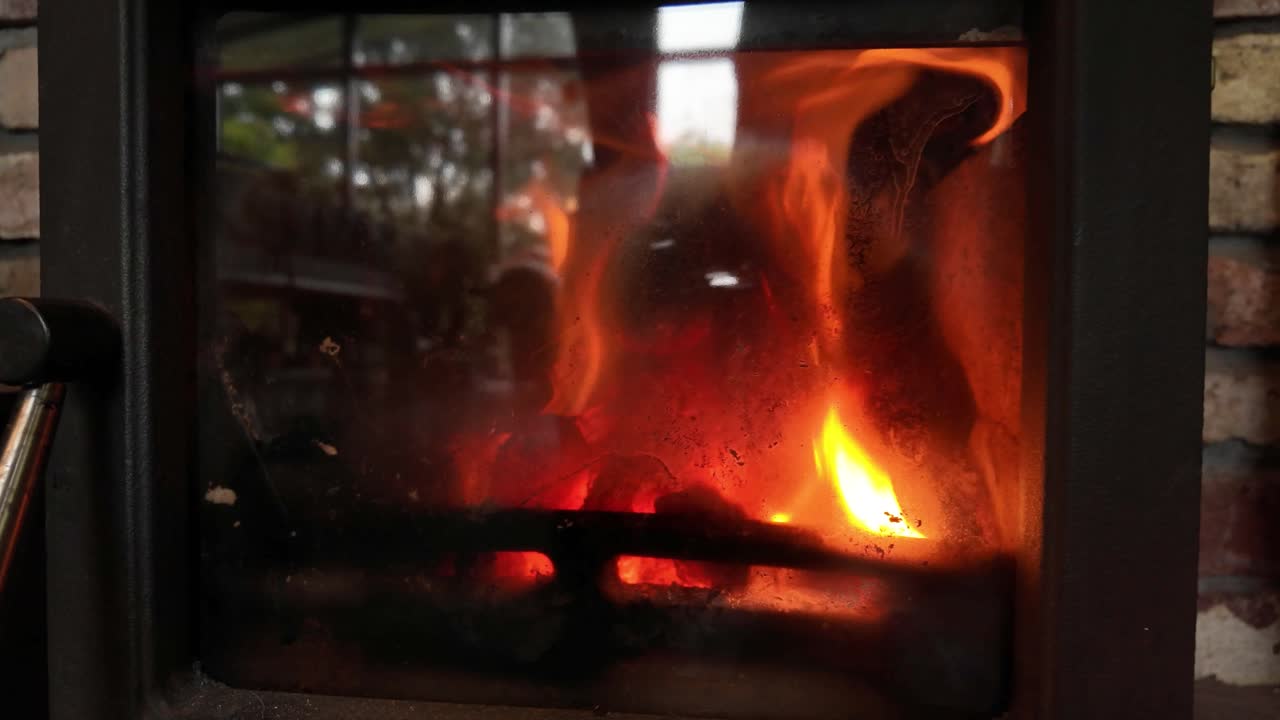 Cozy wood Burning Stove Fireplace Set in Rustic Brick Wall