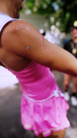 man in pink dress at pride parade