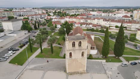 Catholic-church-Santa-Maria-do-Olival-in-Tomar,-Portugal,-aerial-orbit