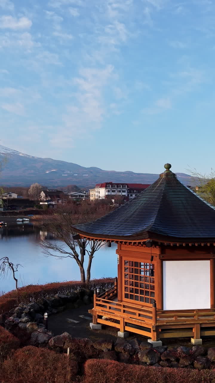 Aerial drone view of a temple with Mount Fuji on the background in Fujikawaguchiko, Japan