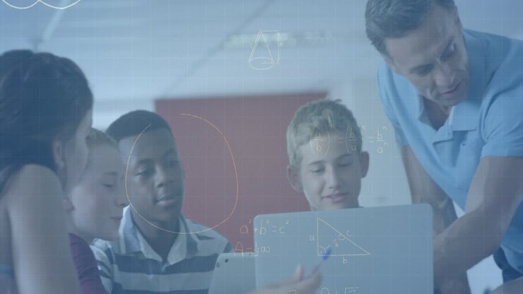 Animation of mathematical equations with male teacher and school children using laptop in classroom
