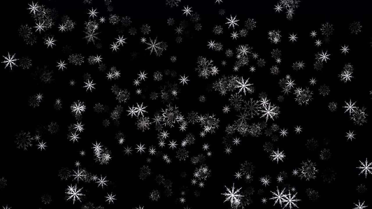 Fallende snøflak på en svart bakgrunn