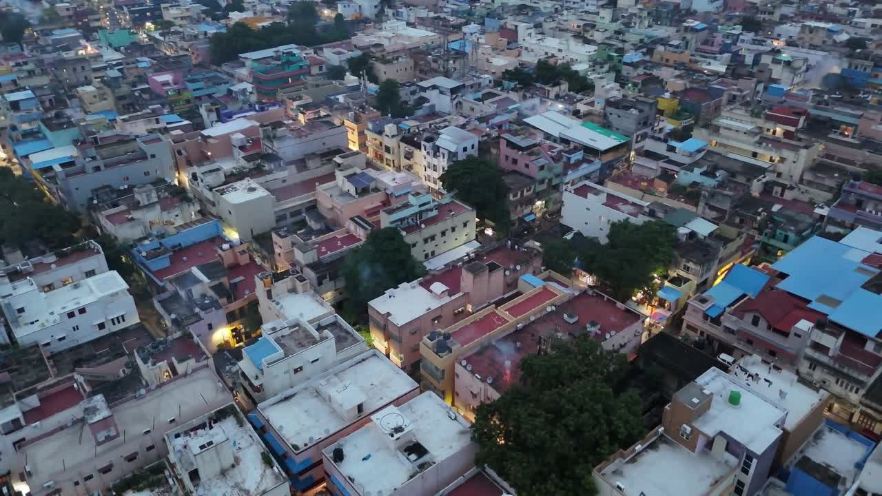 Chennai city aerial: on Diwali, fireworks burst across the night sky as dense smoke settles over crowded neighborhoods, creating a bright yet polluted Diwali atmosphere in the Indian city