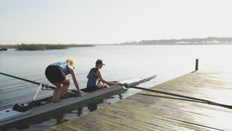 female rowers training on a river