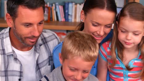 Family-smiling-together-on-couch