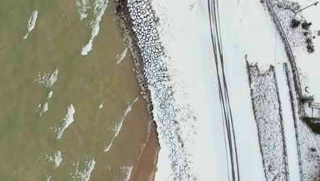 Aerial-track-along-the-crashing-waves-and-rocky-coast