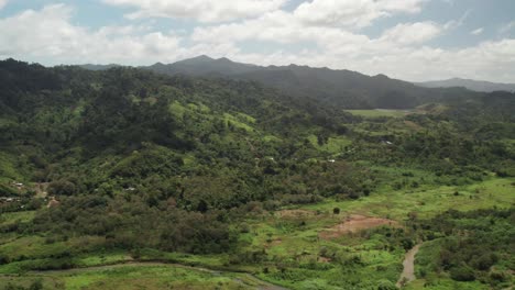 aerial view over the town of el guapo in miranda state, venezuela with lush mountains