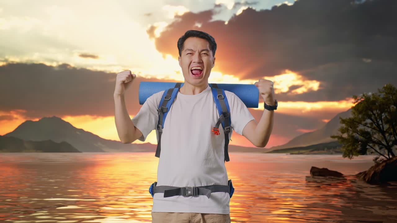 Asian Male Hiker With Mountaineering Backpack Screaming Goal Celebrating The Success At A Lake