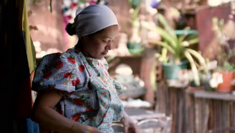 Waitress-folding-tablecloth