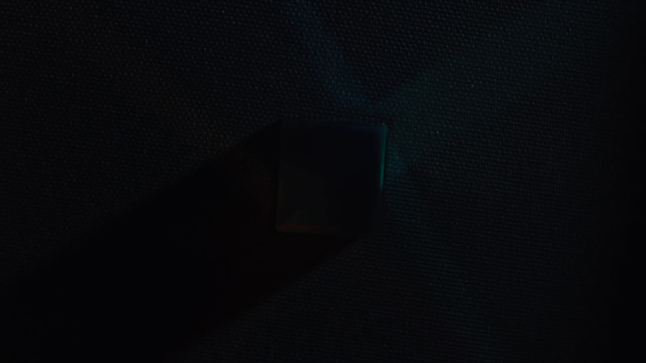 Top shot of refracting colored cubes and soft light with a blue base