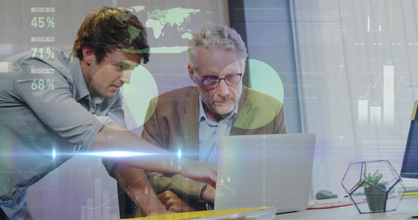 Younger man pointing at laptop screen and explaining animated business charts for mentor review