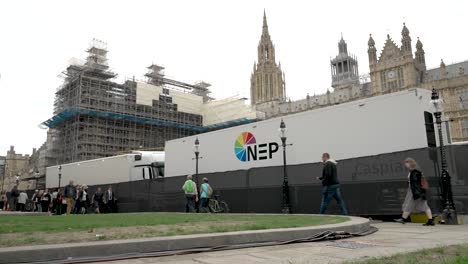 caspian nep ob broadcast truck parked outside houses of parliament. low angle, locked off