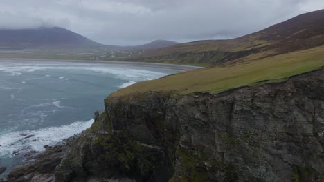 Drone-flying-over-the-high-cliffs-near-Keel-beach-in-Ireland