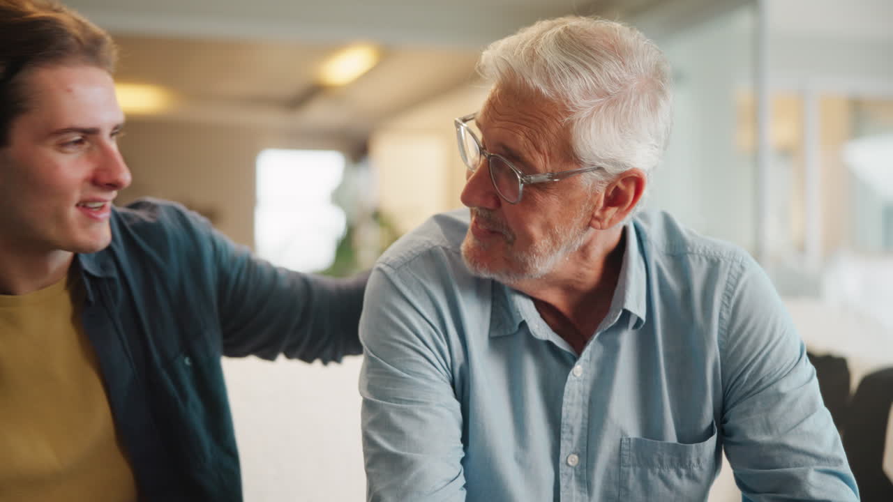 Generational Bonding: An Elderly Man and a Young Man Share a Heartfelt Connection