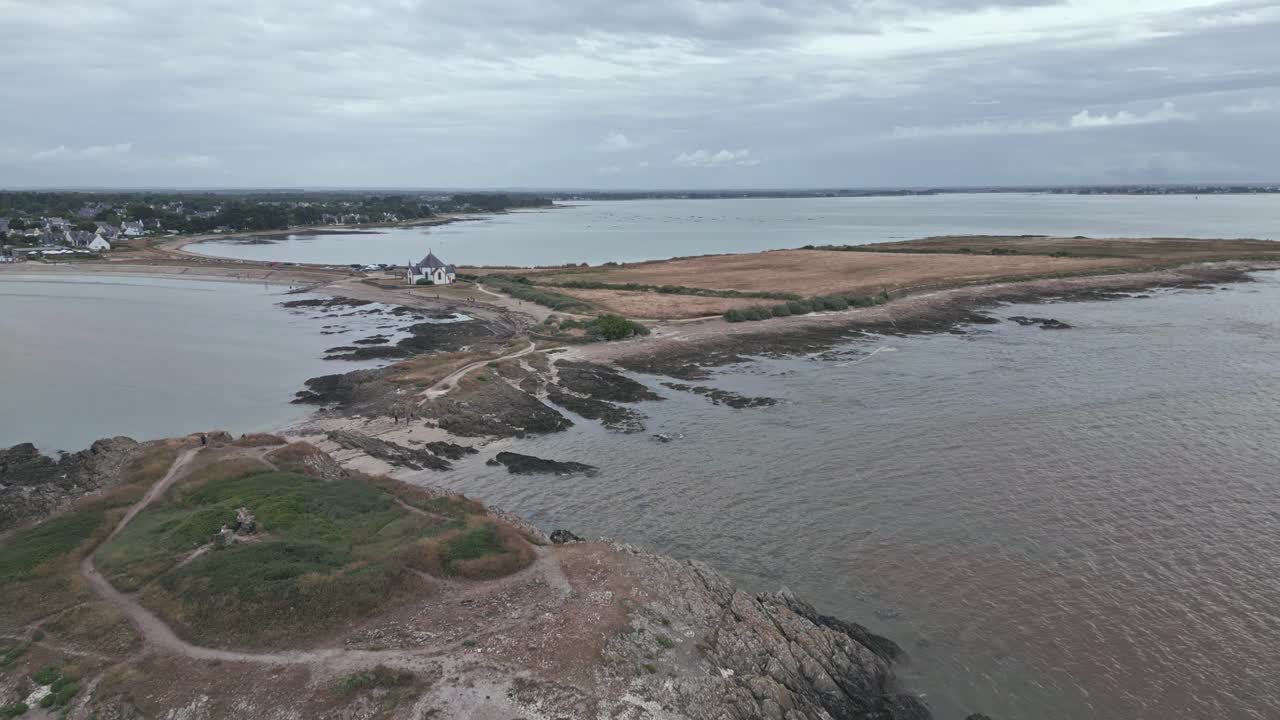 Penvins coast and Notre-Dame-de-la-C&ocirc;te Chapel in background at Morbihan Gulf in Brittany, France