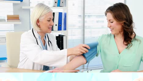 Female-doctor-checking-blood-pressure-of-a-patient