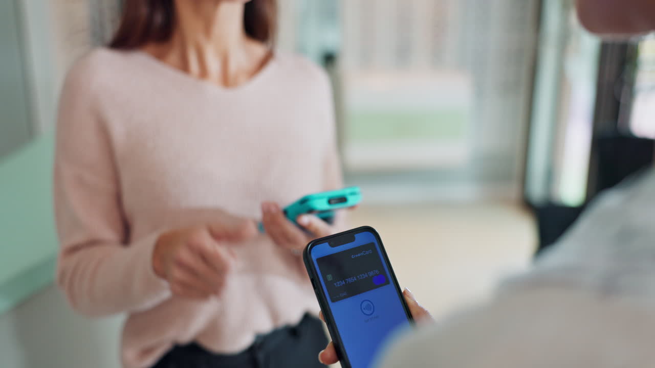 Woman making a mobile payment with her smartphone