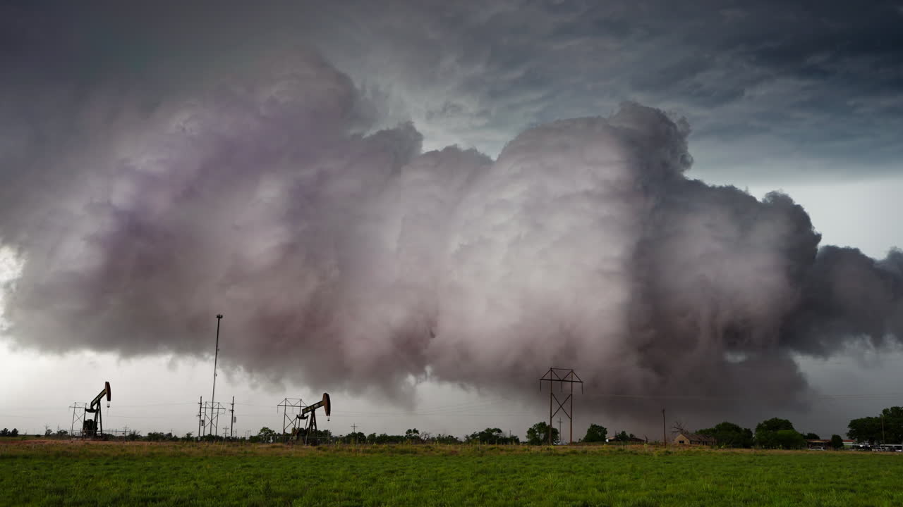 Dramatic Storm Clouds Loom Over an Oil Field