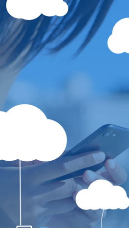 animación de nubes con dispositivos electrónicos sobre una mujer caucásica usando un teléfono inteligente