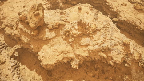 sandstone rock formations in a desert landscape with bright sunlight
