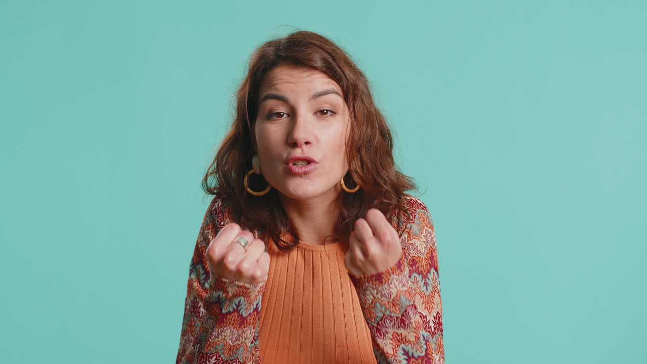 Aggressive bully woman trying to fight at camera shaking fist boxing with expression punishment