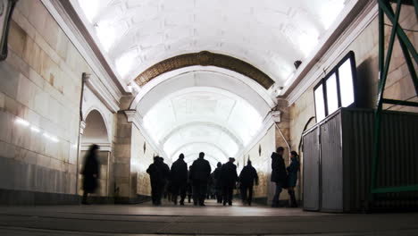 people crowd in the tunnel metro station