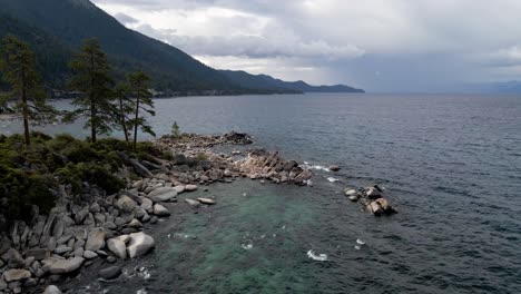 4k-Aerial-Drone-Footage-of-Lake-Tahoe-Rocky-shoreline-and-Sierra-Nevada-Mountains-in-northern-california