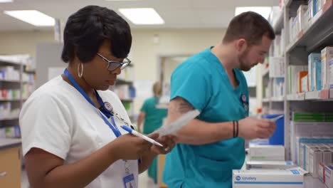 pharmacists checking prescriptions