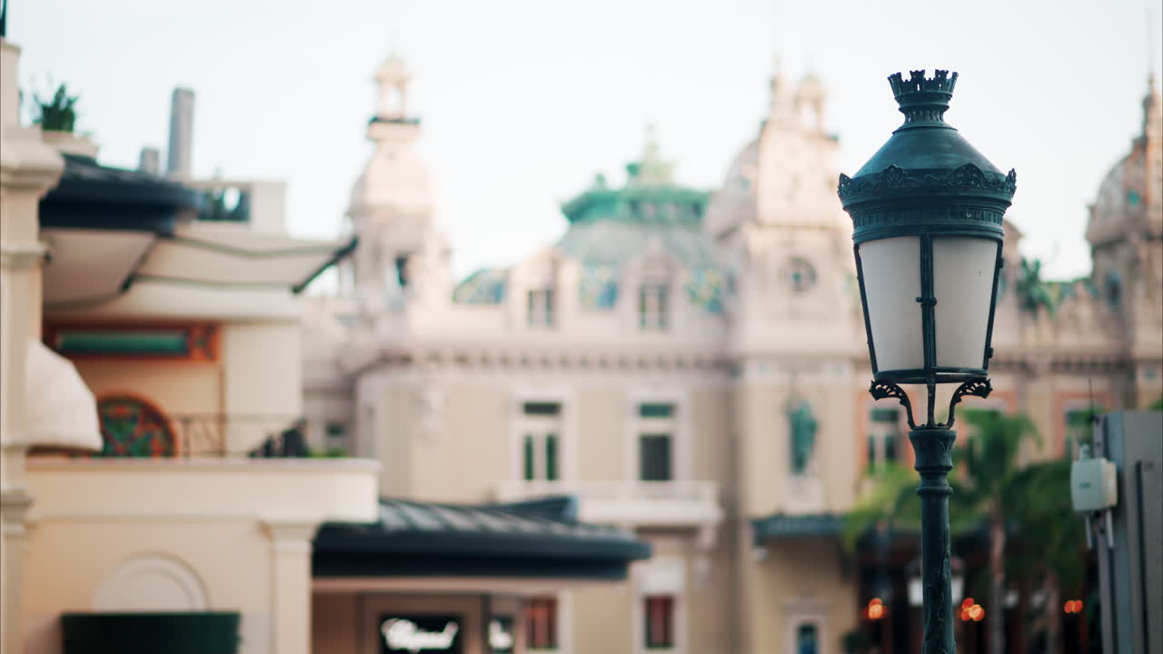 Close up of a street lamp with a blurry city view of Monaco